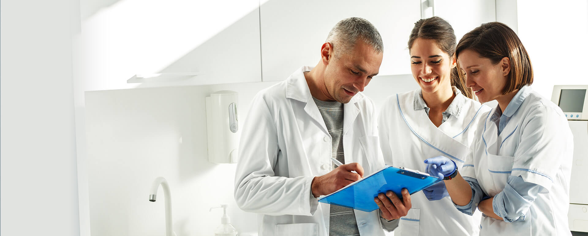dental staff looking over a chart together